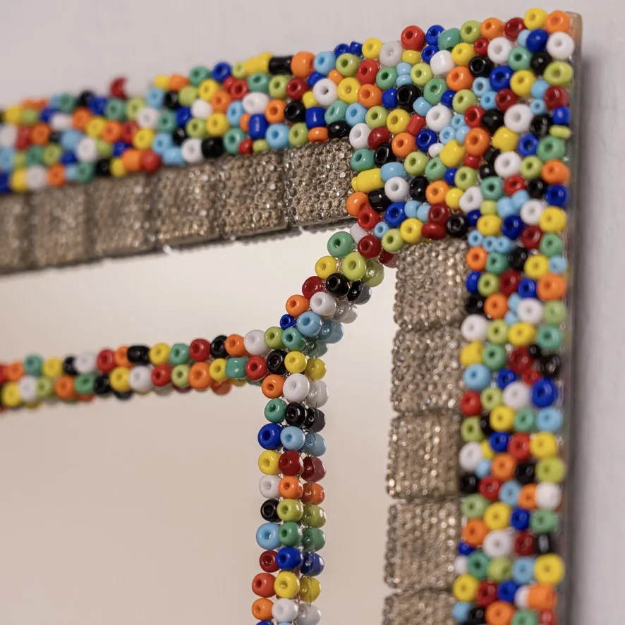 Hand-applied detailing on a Jo.Sa Interiors statement mirror